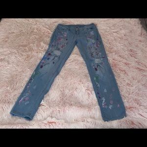 Paint splattered blue jeans